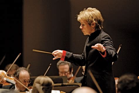 what is a music director and how does it differ from a conductor?